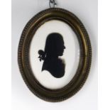 ATTRIBUTED TO HOUGHTON & BRUCE (British fl. 1792-1796) SILHOUETTE PORTRAIT MEDALLION. of a young