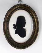 ATTRIBUTED TO HOUGHTON & BRUCE (British fl. 1792-1796) SILHOUETTE PORTRAIT MEDALLION. of a young