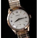 9CT GOLD GARRARD GENTS WRISTWATCH, the dial with pointed batons and Arabic numerals at 3, 9 and 12