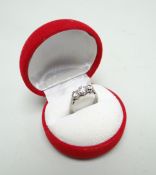18CT WHITE GOLD THREE-STONE DIAMOND RING, the three stones totalling 0.6cts approx. (visual