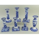 SEVEN CAULDON 'BLUE CHARIOTS' BLUE & WHITE' PRINTED CANDLESTICKS, including two pairs with square