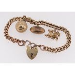 9CT GOLD CHARM BRACELET, curb link, with three 9ct gold charms comprising rugby ball, football and