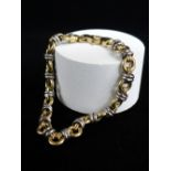 18CT GOLD TWO-TONE BRACELET of link design, 18.5cms long, 13.1gms