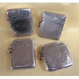 FOUR SIMILAR SILVER VESTA CASES of similar size and shape, all profusely engraved, Birmingham