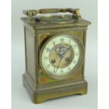FRENCH BRASS COMBINATION MANTEL CLOCK in the form of an oversized carriage clock, the swing handle