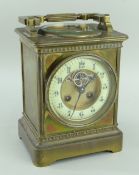 FRENCH BRASS COMBINATION MANTEL CLOCK in the form of an oversized carriage clock, the swing handle