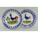 TWO CIRCULAR LLANELLY POTTERY COCKEREL PLATES, blue border and the cockerels blue with red tails,