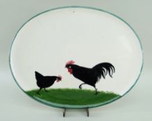 LLANELLY POTTERY COCKEREL & HEN OVAL TRAY, 24.5 x 31.5cms diam Provenance: private collection west