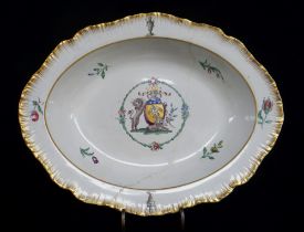 ARMORIAL DISH ATTRIBUTED TO SWANSEA EARTHENWARE with feathered edge and centred coat of arms in