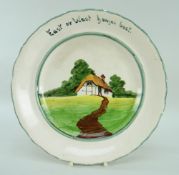 A RARE LLANELLY POTTERY COTTAGE DECORATED PLATE with inscription to border 'East or West homes