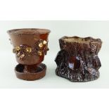 TWO BUCKLEY POTTERY PLANTERS the principle of pedestal form over drip-dish, both in brown glaze