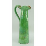 TALL EWENNY SLIPWARE POTTERY TAPERED JUG with loop handle and curvaceous neck, green glaze, signed