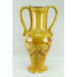 A EWENNY POTTERY AMPHORA SHAPED FLOOR VASE with twin handles and spreading circular foot, yellow