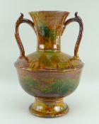 EWENNY POTTERY LARGE TWIN-HANDLED AMPHORA SHAPED VASE in mottled green and brown glaze, bulbous