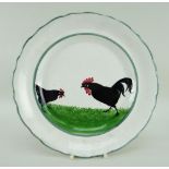 A LLANELLY POTTERY COCK & HEN DECORATED PLATE the birds pecking on grass and within green continuous