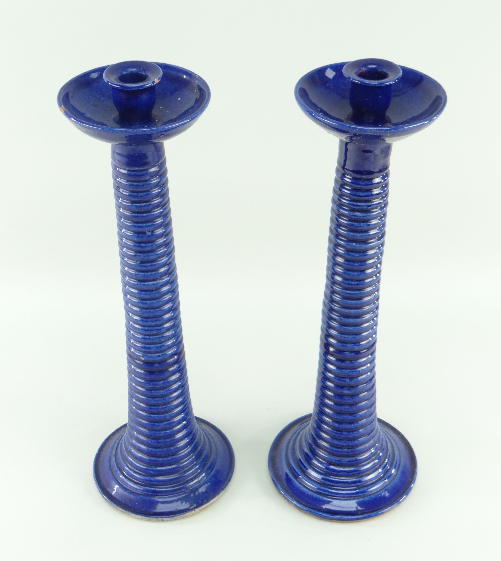 A PAIR OF EWENNY POTTERY TALL CANDLESTICKS circular based with ribbed tapering stems, bowl shaped - Image 2 of 2