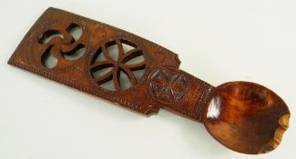 19TH CENTURY SYCAMORE CARVED LOVE-SPOON decorated with pierced treskelion motif over a pierced