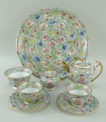 A SWANSEA PORCELAIN CABARET SET comprising teapot, circular tray, pair of tea-bowls with saucers,