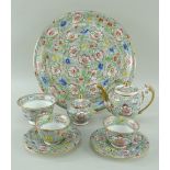 A SWANSEA PORCELAIN CABARET SET comprising teapot, circular tray, pair of tea-bowls with saucers,