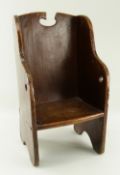 WELSH ELM CHILD'S CORRECTION CHAIR 17/18th Century, simple four panel construction with curved