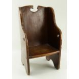 WELSH ELM CHILD'S CORRECTION CHAIR 17/18th Century, simple four panel construction with curved