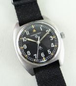 HAMILTON MILITARY ISSUE STAINLESS STEEL WRISTWATCH, c. 1977, circular black dial with broad arrow