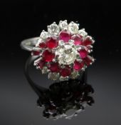 18CT WHITE GOLD DIAMOND & RUBY CLUSTER RING, the central stone 0.3cts approx. (visual estimate),