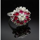 18CT WHITE GOLD DIAMOND & RUBY CLUSTER RING, the central stone 0.3cts approx. (visual estimate),