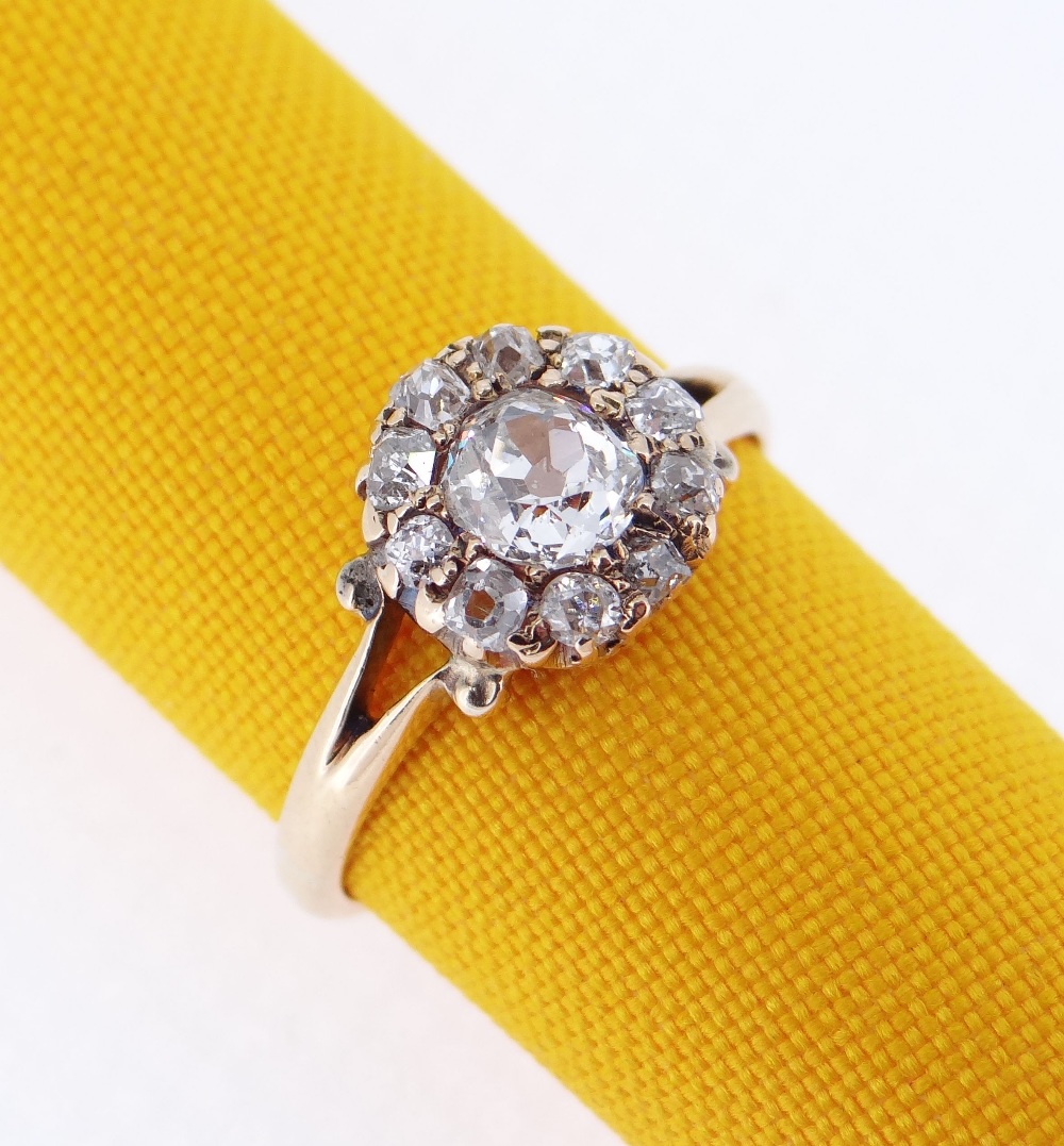 YELLOW METAL DIAMOND CLUSTER RING, the central stone 0.4cts approx. (visual estimate), surrounded by - Image 2 of 4