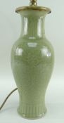 CHINESE MING-STYLE CELADON VASE, Republic, baluster form and carved with stiff leaf collar to