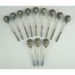 TWO SETS RUSSIAN ENAMEL & SILVER GILT TEASPOONS, 1908-1917, one a set of nine with makers mark 'EO',