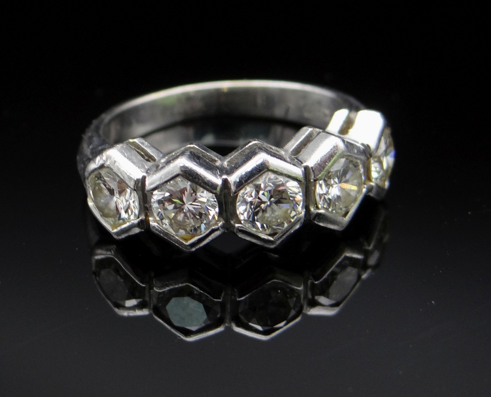 18CT WHITE GOLD FIVE STONE DIAMOND RING, in geometric setting, the five diamonds totalling 0.75cts