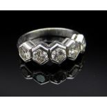 18CT WHITE GOLD FIVE STONE DIAMOND RING, in geometric setting, the five diamonds totalling 0.75cts
