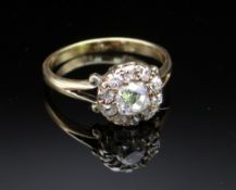 YELLOW METAL DIAMOND CLUSTER RING, the central stone 0.4cts approx. (visual estimate), surrounded by