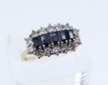 18CT GOLD SAPPHIRE & DIAMOND CLUSTER RING, the five central sapphires surrounded by fourteen