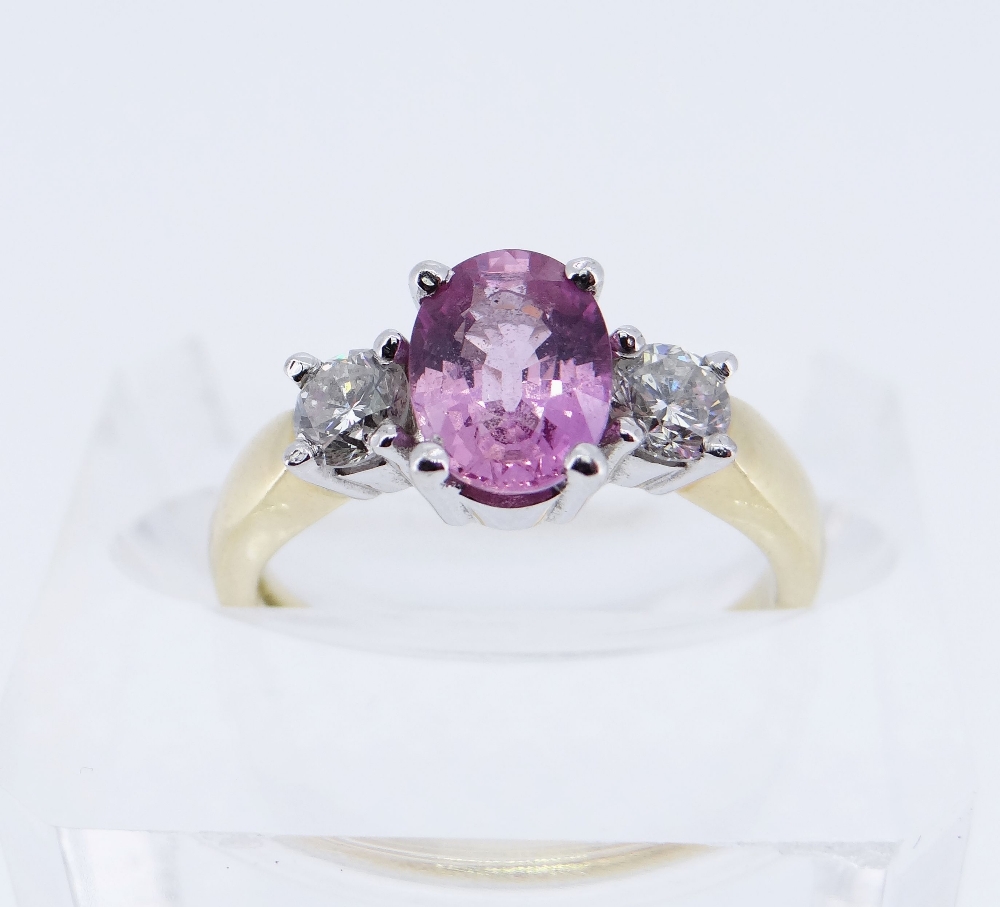 18CT GOLD PINK SAPPHIRE & DIAMOND THREE STONE RING, the central oval sapphire 8 x 6mms, total