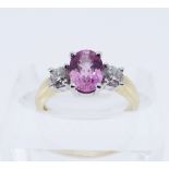 18CT GOLD PINK SAPPHIRE & DIAMOND THREE STONE RING, the central oval sapphire 8 x 6mms, total