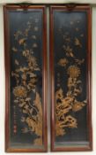 PAIR CHINESE DONGYANG WOOD CARVINGS, 20th Century, depicting vertical sprays of chrysanthemums