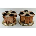 PAIR COPPER & BRASS WINE COOLERS, each with four bottle sleeves around a central lidded ice