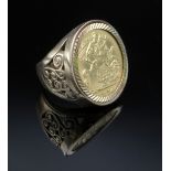 9CT GOLD PIERCED HALF SOVEREIGN RING, ring size K, 10.8gms