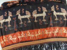 SUMBA IKAT HIP OR SHOULDER CLOTH hinggi, dyed in red and indigo with confronting stylised animals (
