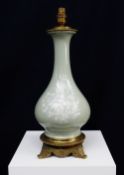 FRENCH CELADON PATE SUR PATE PORCELAIN LAMP, gilt metal mounts, 39cms (excluding bulb fitting)