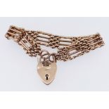 9CT GOLD GATE LINK BRACELET with heart shaped padlock, 20.4gms