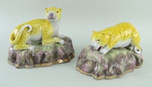 PAIR MODERN CHINESE PORCELAIN MODELS OF LEOPARDS, recumbent on rocky bases, in the Victorian