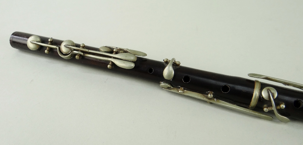 ANTIQUE ROSEWOOD 8-KEY FLUTE, nickel keys and collars, 67cms long Comment: mouthpiece cracked, lower