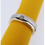 14K WHITE & YELLOW GOLD MODERNIST RING, set with three diamonds, ring size U, 11.4gms