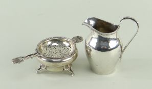 EDWARDIAN SILVER MILK JUG & GEORGE V TEA STRAINER, jug with reeded strap handle, strainer with shell