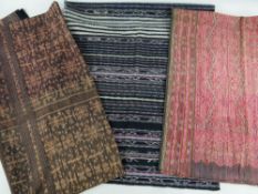 THREE INDONESIAN TEXTILES, comprising FLORES IKAT TUBE SARONG, dyed charcoal and brown, various