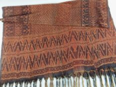FLORES MEN'S IKAT CEREMONIAL SHAWL lio, Indonesia, red an chocolate dyed yarns woven with