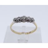 18CT GOLD & PLATINUM FIVE STONE DIAMOND RING, ring size U, 2.7gms